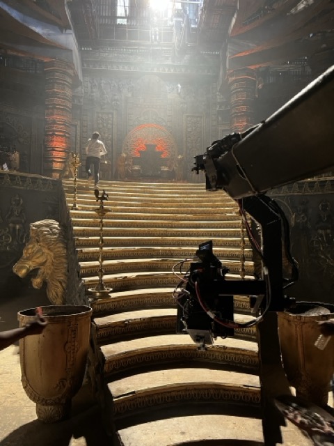 Cinema camera overlooking the illuminated SUMN4U staircase set